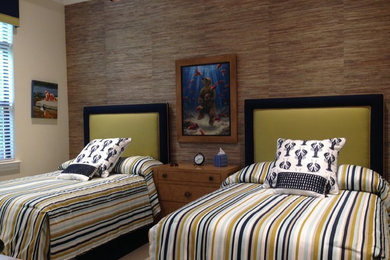 Example of a mid-sized beach style guest bedroom design in Miami with blue walls