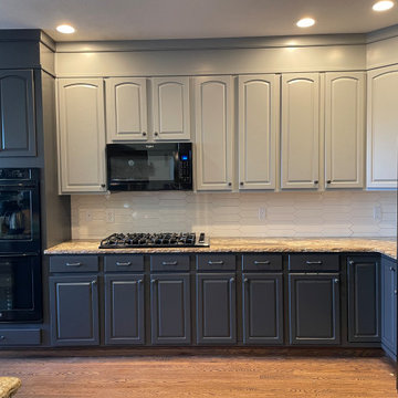 Refinished two-tone kitchen cabinets