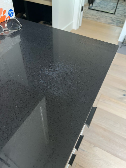 help! need advice regarding discoloration on black quartz countertops
