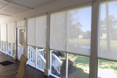 Inspiration for a large farmhouse back porch remodel in Wilmington with decking and a roof extension