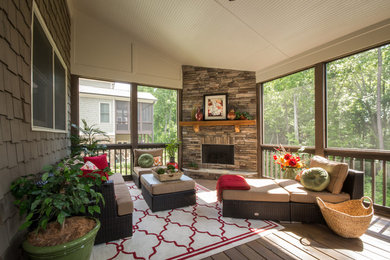 Large transitional backyard patio photo in Atlanta with a fire pit, decking and a roof extension