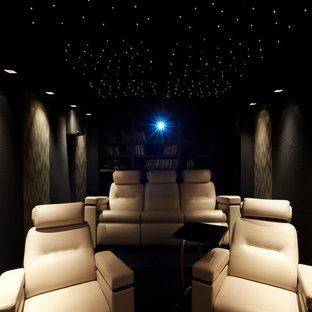 Mid-sized trendy enclosed home theater photo in Paris with a projector screen