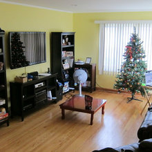 Yellow living room with dark furnitures