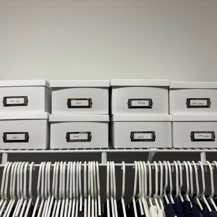 Organized Photo Boxes on a Shelf