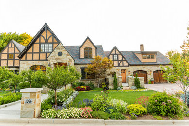Example of a french country exterior home design in Salt Lake City