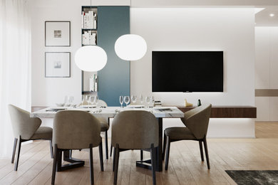 Immagine di una sala da pranzo aperta verso il soggiorno design di medie dimensioni con pareti bianche e parquet chiaro