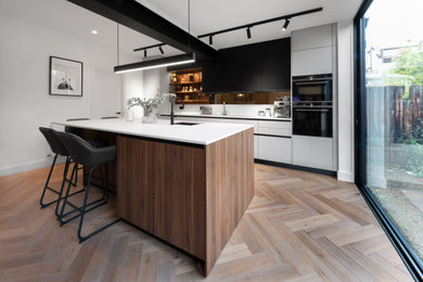 Design ideas for a modern kitchen in London with an island.