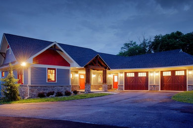 Inspiration for a large craftsman blue split-level wood exterior home remodel in Other with a shingle roof