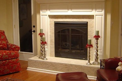 Large elegant open concept medium tone wood floor living room photo in Charlotte with a music area, yellow walls, a standard fireplace, a tile fireplace and no tv