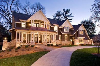 Large elegant brown three-story wood gable roof photo in Minneapolis