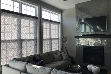 Inspiration for a large traditional family room in New York with grey walls.
