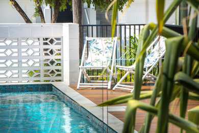 Photo of a midcentury pool in Brisbane.
