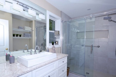 This is an example of a mid-sized modern master bathroom in Other with flat-panel cabinets, a curbless shower, white tile, ceramic tile, mosaic tile floors, a trough sink, granite benchtops, white floor and a sliding shower screen.