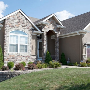 Insulated Designer Garage Doors & Stone Siding