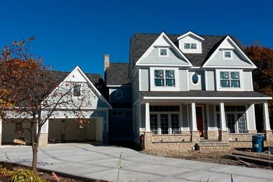 Traditional blue three-story mixed siding exterior home idea in Chicago with a clipped gable roof