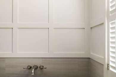 Mid-sized elegant master beige tile and porcelain tile porcelain tile and beige floor bathroom photo in St Louis with recessed-panel cabinets, dark wood cabinets, a one-piece toilet, beige walls, an undermount sink, quartzite countertops, a hinged shower door and beige countertops