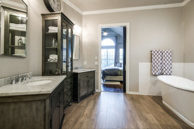 Mid-sized transitional master white tile and subway tile porcelain tile bathroom photo in Austin with furniture-like cabinets, gray cabinets, a one-piece toilet, gray walls, an undermount sink and marble countertops