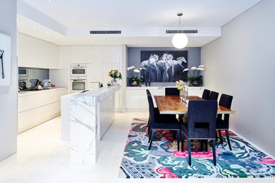 Mid-sized contemporary open plan dining in Sydney with ceramic floors.