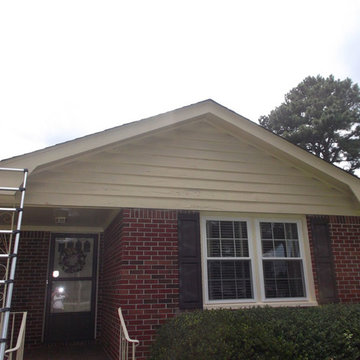 Before: Deteriorating Wood Siding