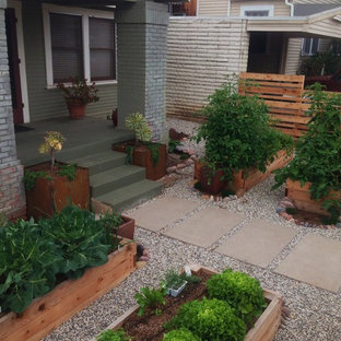 Photo of a mid-sized country front yard full sun formal garden in San Diego with a vegetable garden and gravel.