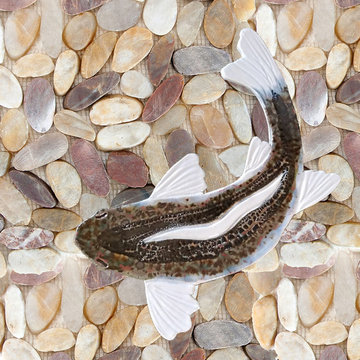Wine sliced pebble, rock, and stone shower floor with a Walleye fish mosaic tile