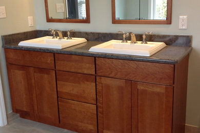 Inspiration for a timeless bathroom remodel in Other with shaker cabinets, medium tone wood cabinets and quartz countertops
