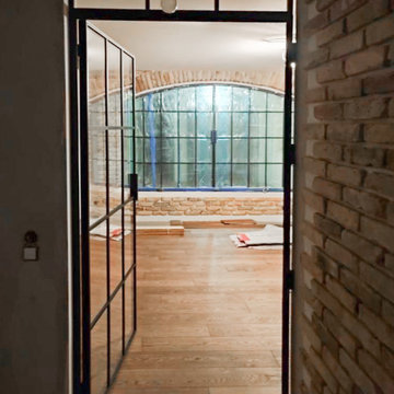 Arched steel doors for the wine cellar