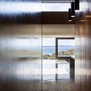 Large contemporary kitchen pantry ideas - Large trendy galley concrete floor kitchen pantry photo in Hobart with open cabinets and an island