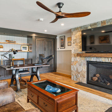 Warm Home Office with Stone Fireplace and Custom Built-Ins