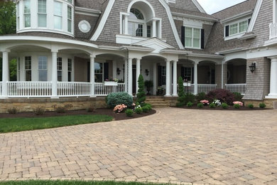 Inspiration for a large traditional front yard driveway in Other.
