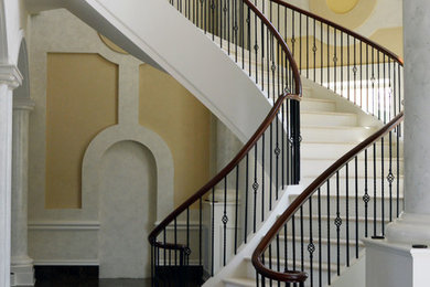 Elegant curved staircase photo in Atlanta
