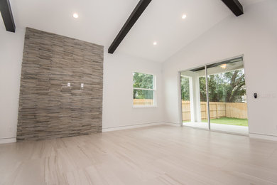 Mid-sized transitional formal and open concept light wood floor and brown floor living room photo in Orlando with gray walls, no fireplace and no tv