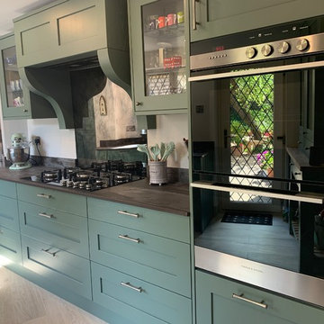Fern green traditional shaker kitchen in a quirky period home.