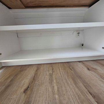 Wire access and plugs finished off inside the cabinet