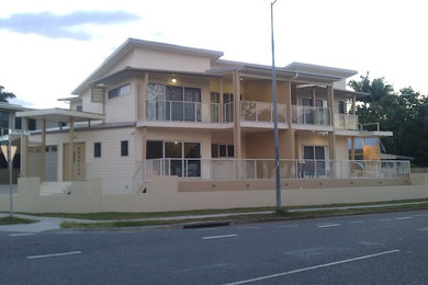 Photo of a large modern home design in Brisbane.