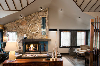 Living room - mid-sized contemporary formal and open concept medium tone wood floor living room idea in Denver with white walls, a standard fireplace, a stone fireplace and no tv