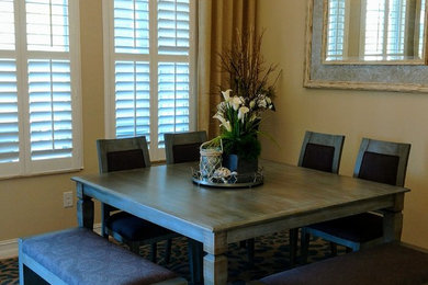 Inspiration for a mid-sized transitional beige floor and travertine floor kitchen/dining room combo remodel in Tampa with yellow walls