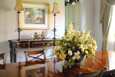 Inspiration for a large timeless porcelain tile enclosed dining room remodel in Miami with gray walls