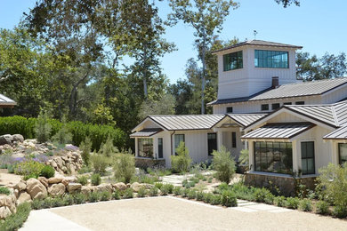 Example of a large two-story house exterior design in Santa Barbara
