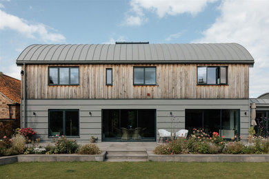 Inspiration for a gey contemporary two floor detached house in Other with mixed cladding, a metal roof and a grey roof.