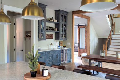 Example of a mountain style home bar design in Manchester