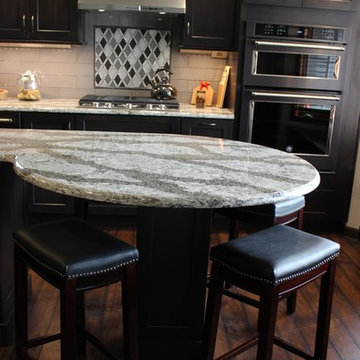 DuraSupreme Peppercorn Kitchen With Cambria Tops and Black Stainless Appliances