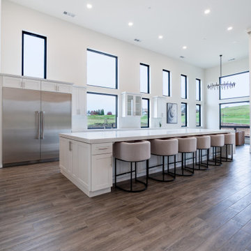 Modern White Shaker Kitchen with Oversized Island & Custom Storage Solutions