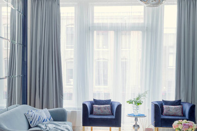 Inspiration for a contemporary formal and enclosed medium tone wood floor and beige floor living room remodel in Amsterdam with white walls