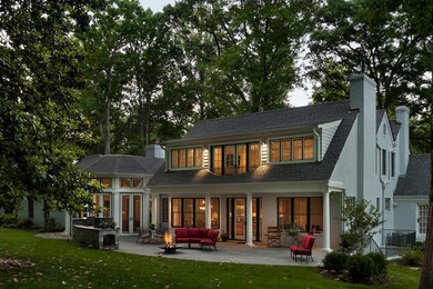 Inspiration for a huge timeless gray two-story brick gable roof remodel in DC Metro