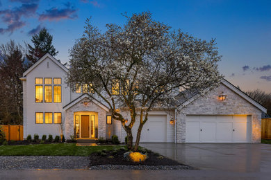 Inspiration for a french country two-story mixed siding exterior home remodel in Seattle with a mixed material roof