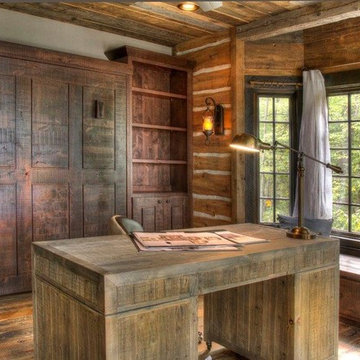 Weathered Antique Paneling, Flooring, and Custom Desk in a Rustic Home Office
