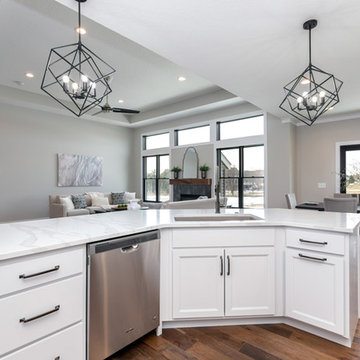McCoy Homes Quad Cities Kitchen With White Cabinets and Matte Black Accents