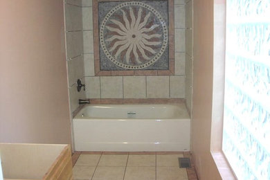 Multicolored tile and ceramic tile travertine floor bathroom photo in Raleigh with pink walls