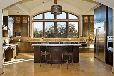 Example of a trendy kitchen design in Nashville with recessed-panel cabinets, dark wood cabinets and beige backsplash